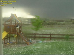 This amazing image of the Windsor tornado was taken from a backyard webcam. Image courtesy MyWindsorWeather.com.