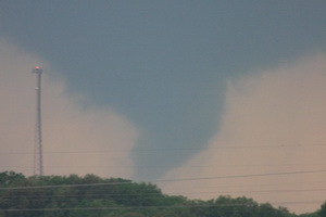 A tornado tears through Adair County Wednesday evening. This photograph was taken by Dr. Curtis Roof from Highway 6, facing west. The tornado traveled on a northeastern path, damaging several homes along the way. (Dr. Curtis Roof/Kirksville Daily Express)